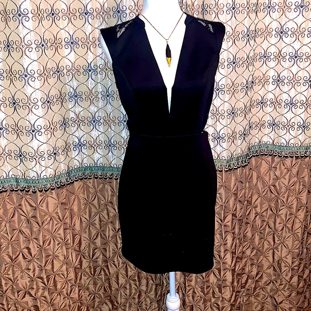 Black cocktail sleeveless low cut dress
